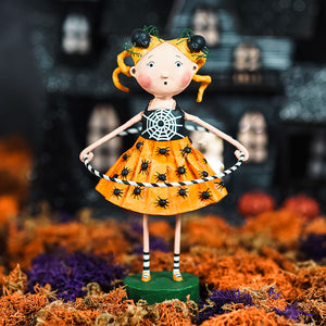 Orange lori mitchell halloween figurine from dolly’s creepy crawlies with black spider motifs and striped socks on green base