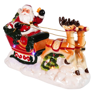 Dolomite led lighted red and white ceramic musical santa in sleigh with tan reindeer spreading holiday cheer
