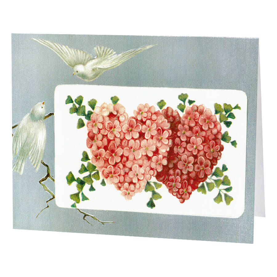 Greeting card featuring two floral hearts with a white dove.