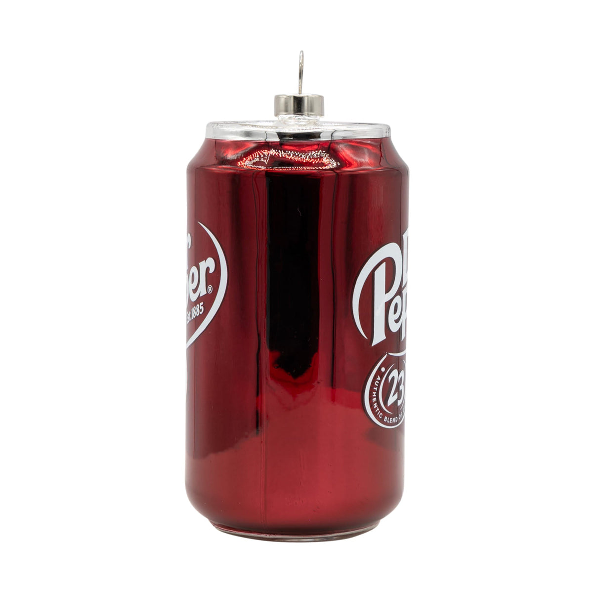 A glossy red glass dr pepper soda can ornament with white branding and silver top perfect for vintage cereal box decor