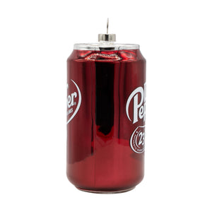 A glossy red glass dr pepper soda can ornament with white branding and silver top perfect for vintage cereal box decor