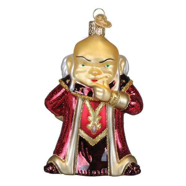 A golden glass dungeons and dragons dungeon master ornament in red and gold robe perfect tabletop decor red box ornament