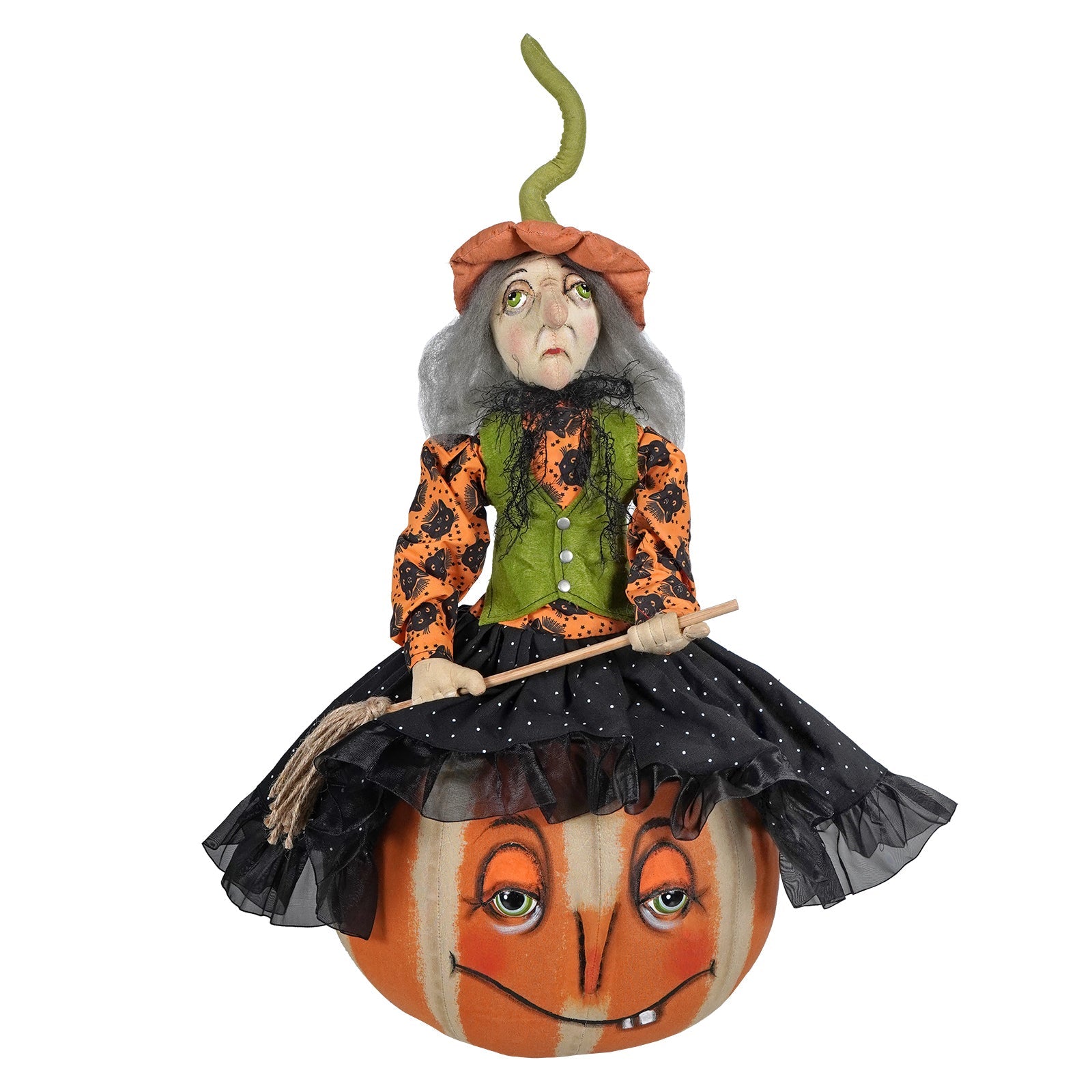 Whimsical halloween witch figurine named eartha with gray hair in orange and black outfit sitting on smiling pumpkin from joe spencer’s gathered traditions design