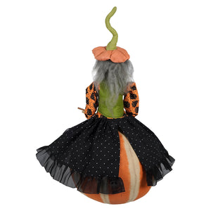 A plush halloween witch doll named eartha with gray hair in joe spencer’s gathered traditions design