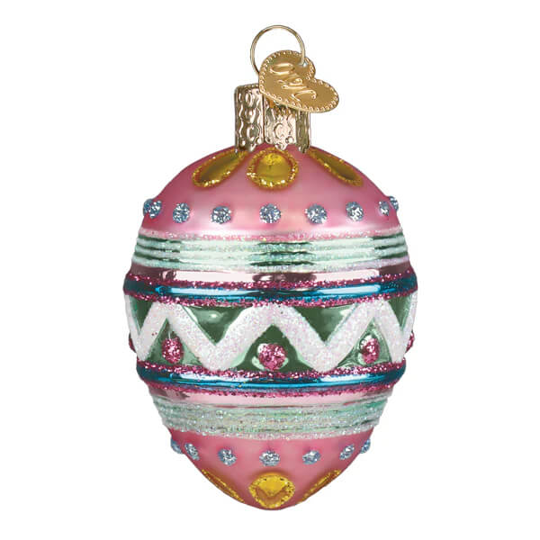 A pink christmas glass ornament easter egg ornament with glittery green white blue stripes rhinestones and gold accents