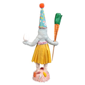 A whimsical handcrafted folk art easter girl elephant in gray with teal bunny hat holding egg and carrot pick broomstick