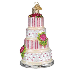 Elegant wedding cake ornament with three-tiered pink and white frosted design and glittery stripes perfect as christmas glass ornament