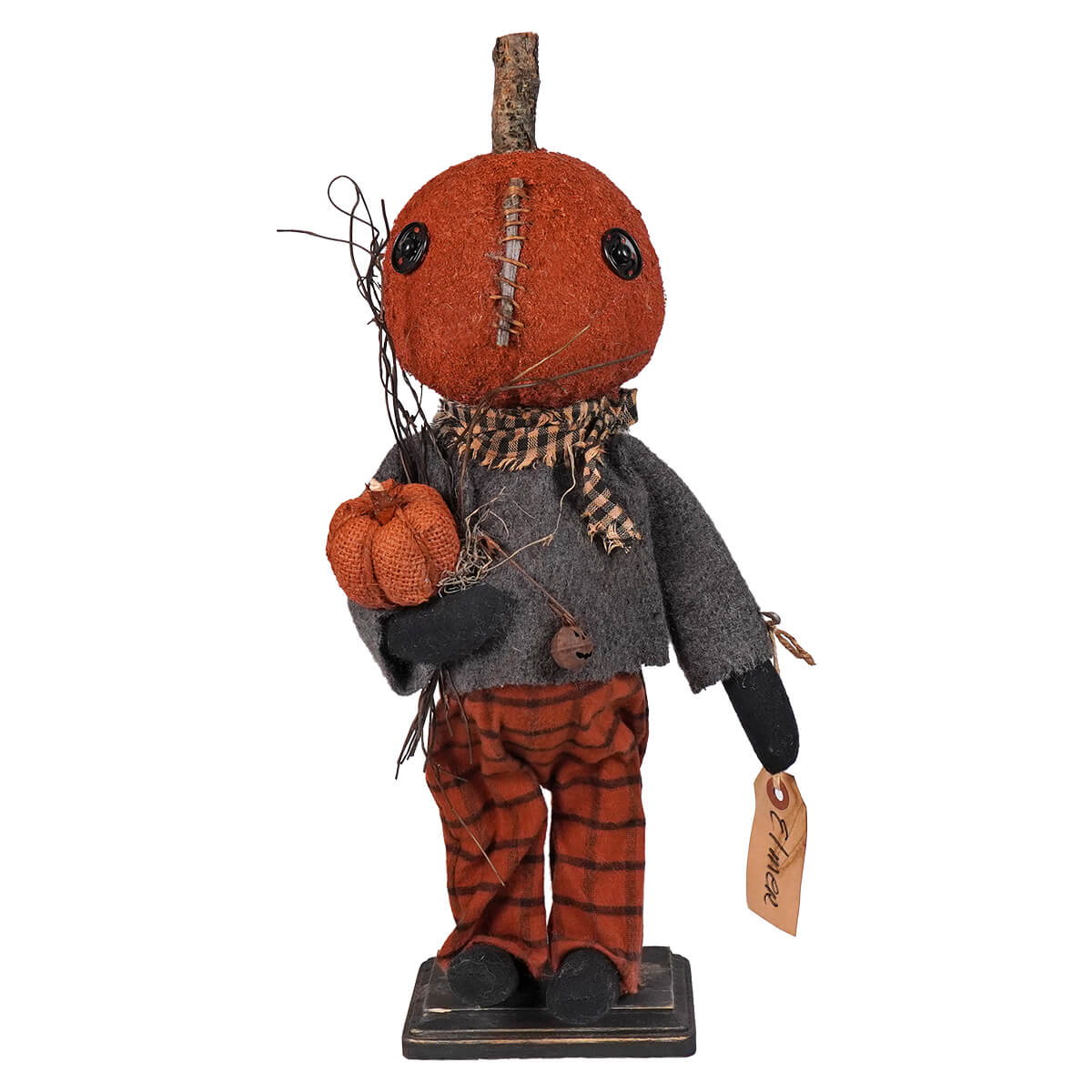 Handcrafted pumpkin-headed doll with a fabric body wearing a gray jacket and striped pants.