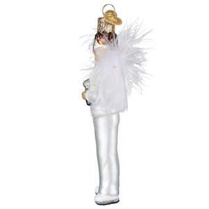 A glass elton john ornament of a white and gold marching band conductor with feathered glittery details perfect for world christmas