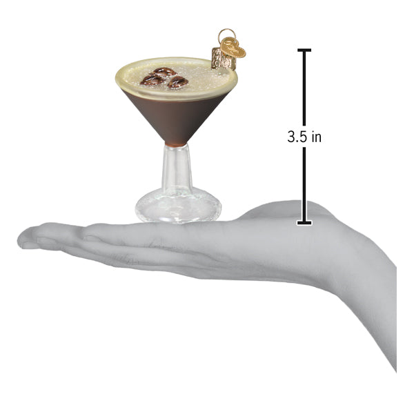Espresso martini ornament with dark brown liquid frothy beige top three chocolate spheres and tiny golden key charm
