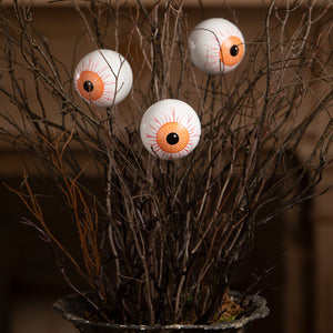 Three white plastic eyeball picks with orange irises and red veins from bethany lowe designs halloween garlands wreaths & picks