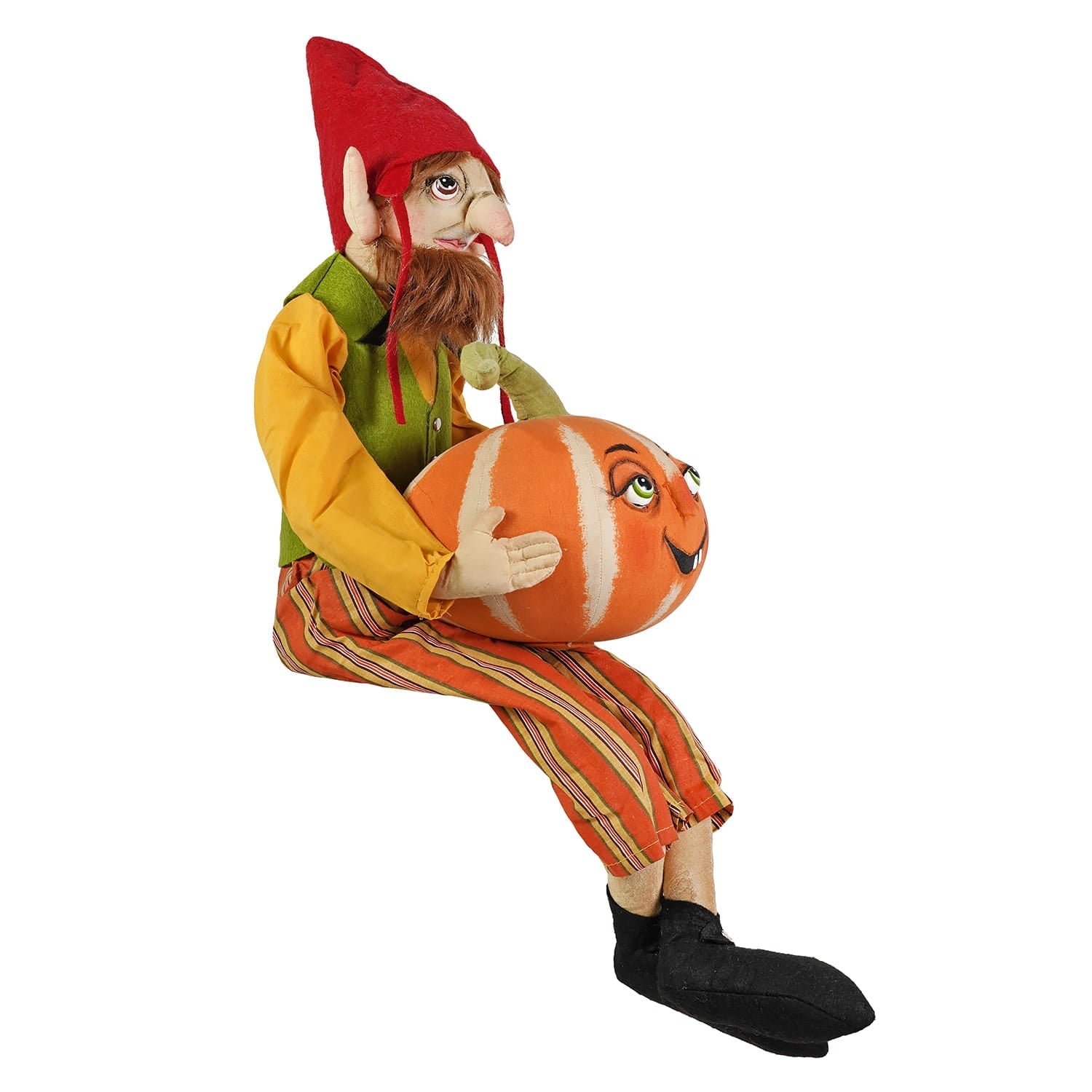 A whimsical ezekiel gnome figurine with a red hat and striped orange trousers holding a pumpkin perfect for figural decor or tree toppers