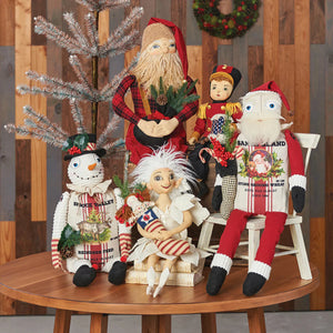 A charming christmas doll set featuring joe spencer snow fairy, a snowman with top hat, angel with candy canes, and festive santas