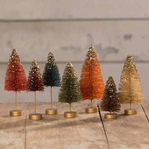 A fall bottle brush trees set of 7 glittery miniature village trees in warm hues on brass bases perfect for decor
