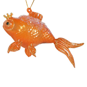 A translucent orange glass goldfish ornament with glittery gold fins and a tiny crown by cody foster