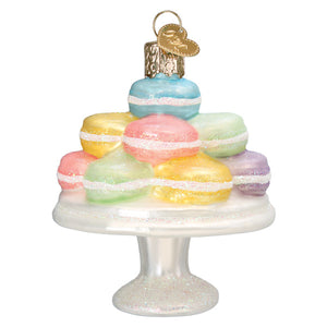 Fancy macarons ornament is a colorful glass figural decor with glittery white frosting and a gold heart cap perfect as lighted decor