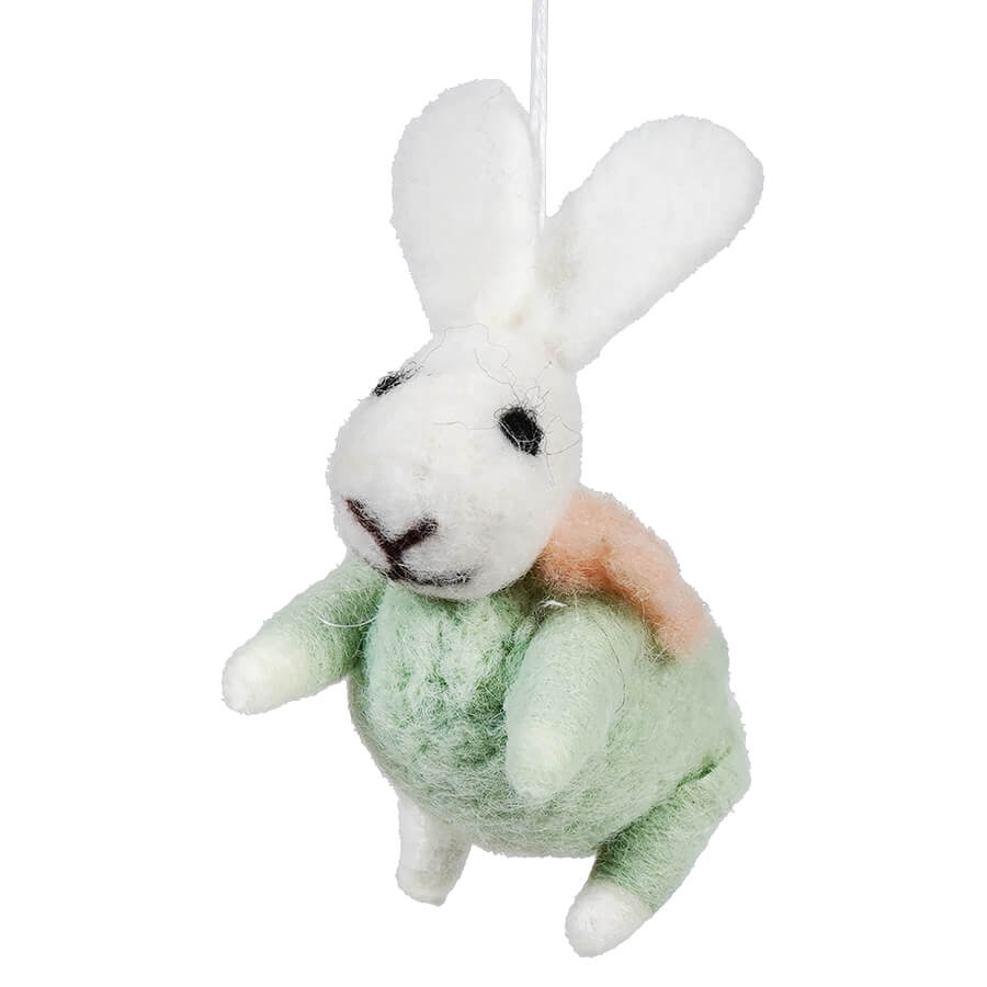 White plush bunny wearing a mint green outfit.
