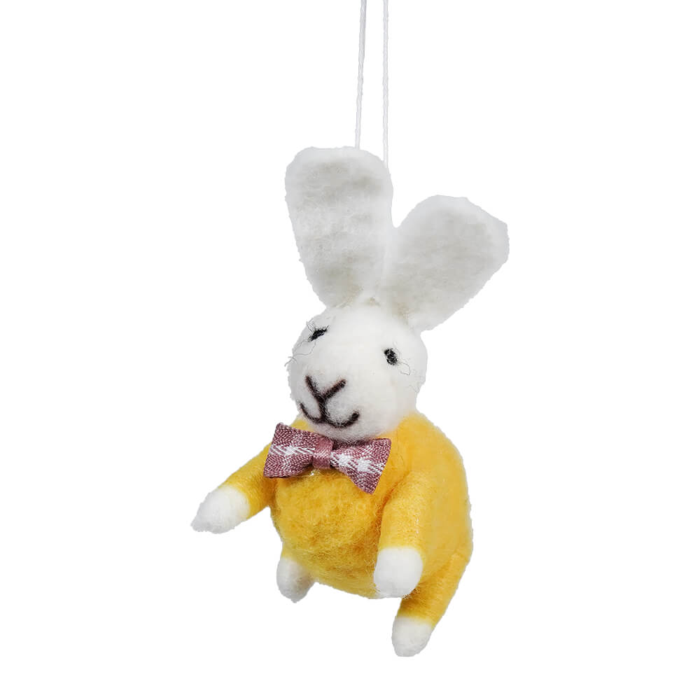 White plush bunny wearing a yellow sweater and red checkered bow tie.