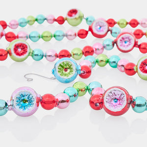 Festive fete 7 foot garland with vibrant hand-blown glass beads in red pink green and teal perfect for fete tinsel decor