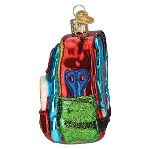 Vibrant multicolored glass first day of school ornament shaped like backpack with glittery green pocket good for figural decor