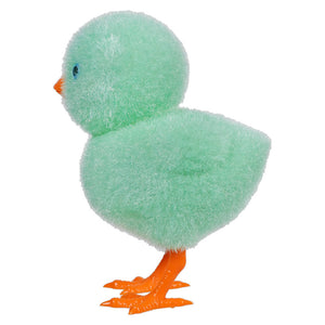 Mint green plush duckling with orange feet and beak.