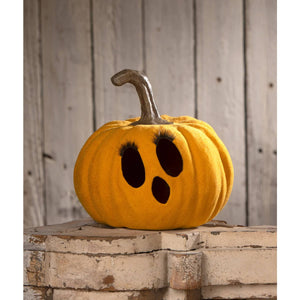 A plush bethany lowe flocked mustard jol pumpkin with metallic stem and ghostly black eye sockets with eyelashes