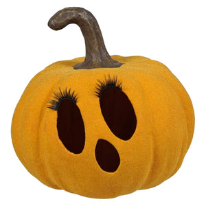 A flocked mustard jol plush orange pumpkin with dark brown stem and black faux eyelashes by bethany lowe tealight product number
