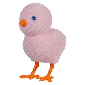 Pink plush duck toy with orange feet and a blue eye.
