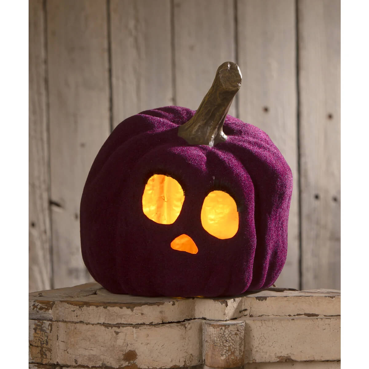 Purple velvet pumpkin with glowing orange face and rustic wooden stem flocked purple jol by bethany lowe design