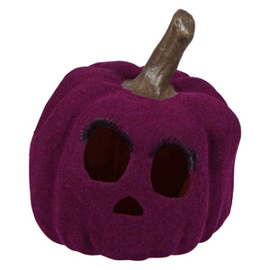 A plush deep purple flocked purple jol pumpkin with textured surface and black eyelashes by bethany lowe design