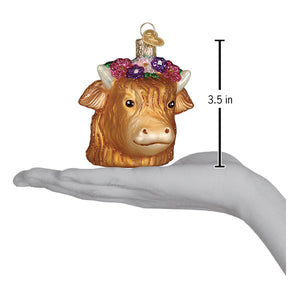 A charming golden glass highland cow ornament with floral crown perfect as lighted figural decor