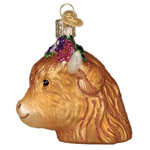 Golden highland cow ornament with glittery fur, floral crown, and heart tag perfect for lighted figural decor