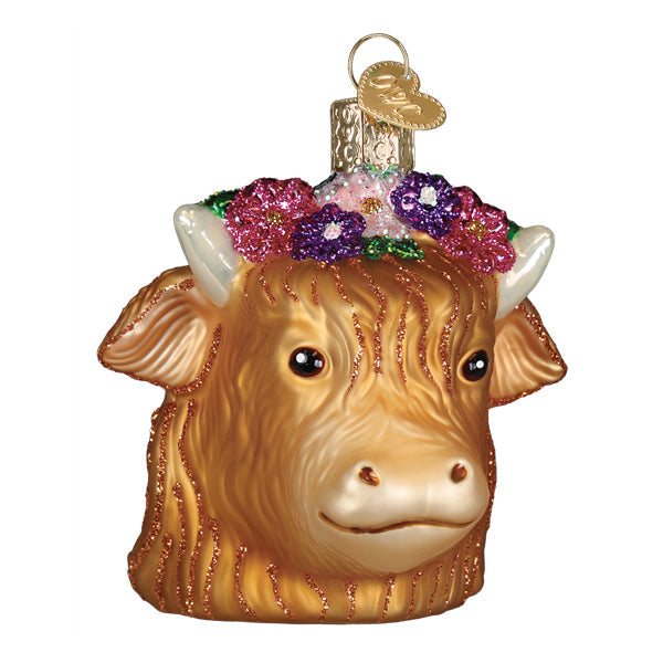 A golden glittery highland cow ornament with a crown of pink and purple flowers perfect for figural decor or lighted decor