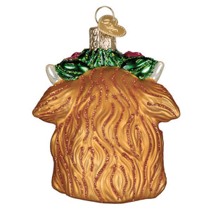 Golden glass highland cow ornament with textured fur and green glittery holly accents perfect for figural decor or lighted decor