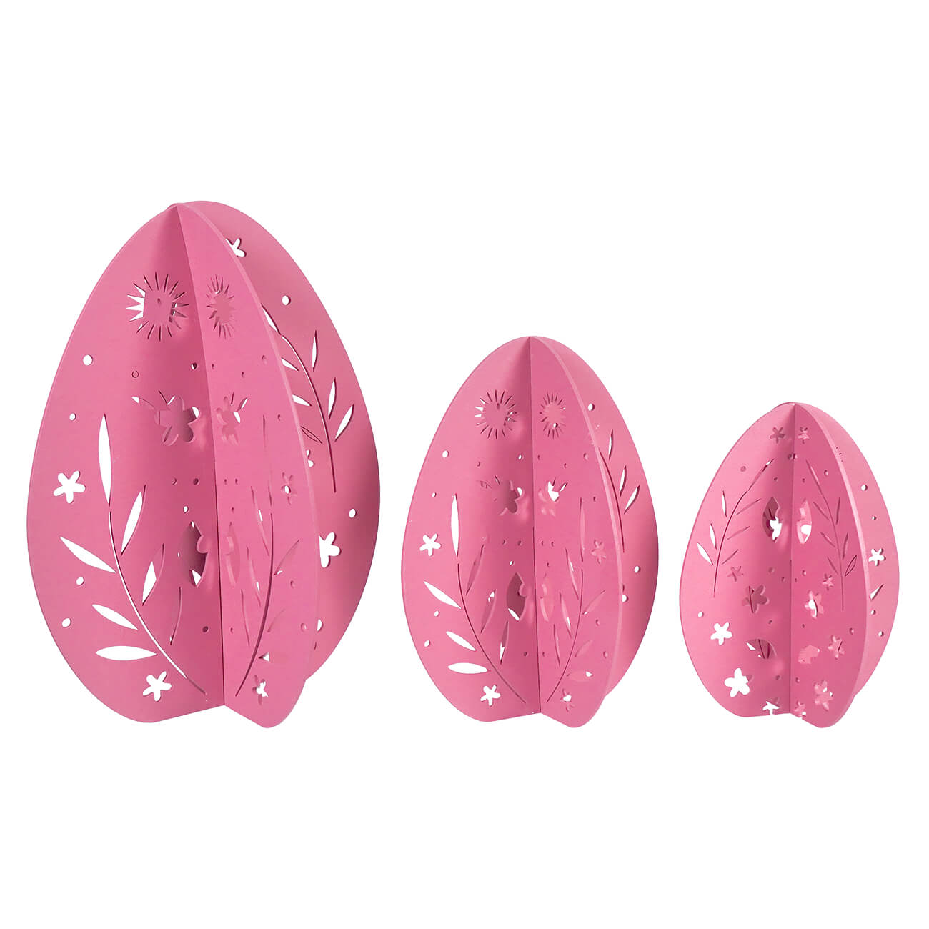 Three pink decorative eggs with floral and star cutout patterns.