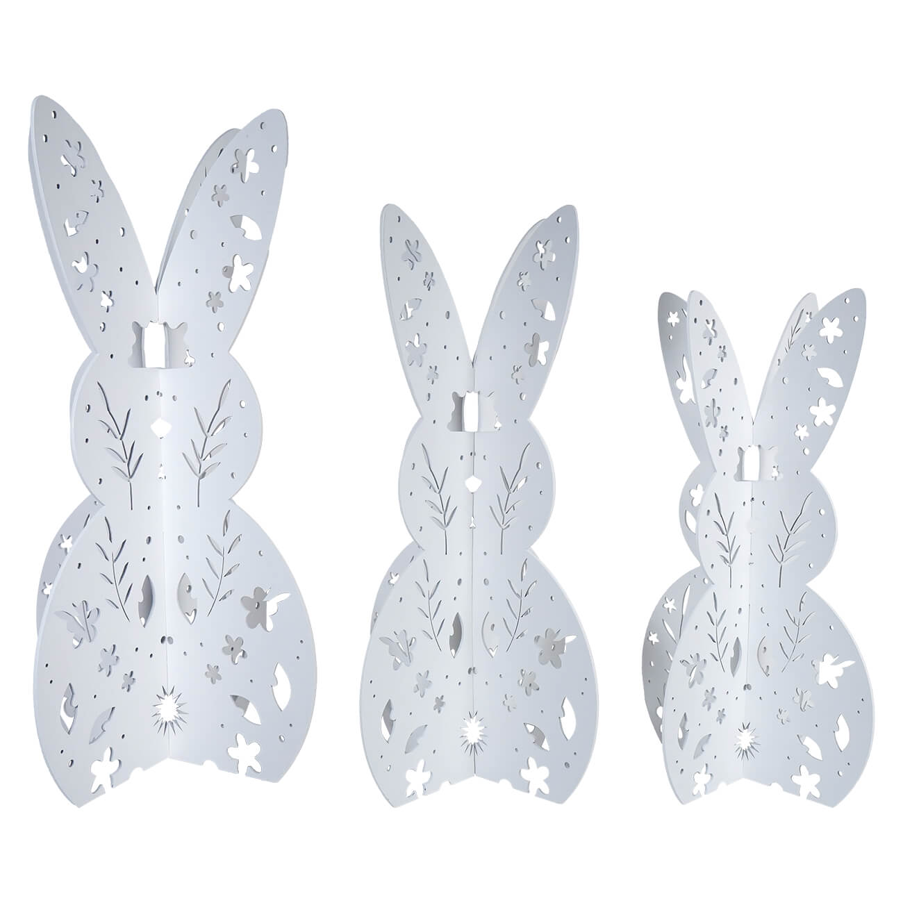 Three decorative white bunny silhouettes with floral cutout patterns.