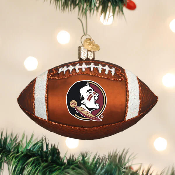 Brown football-shaped christmas glass ornament with white stripes and florida state football logo in maroon and gold