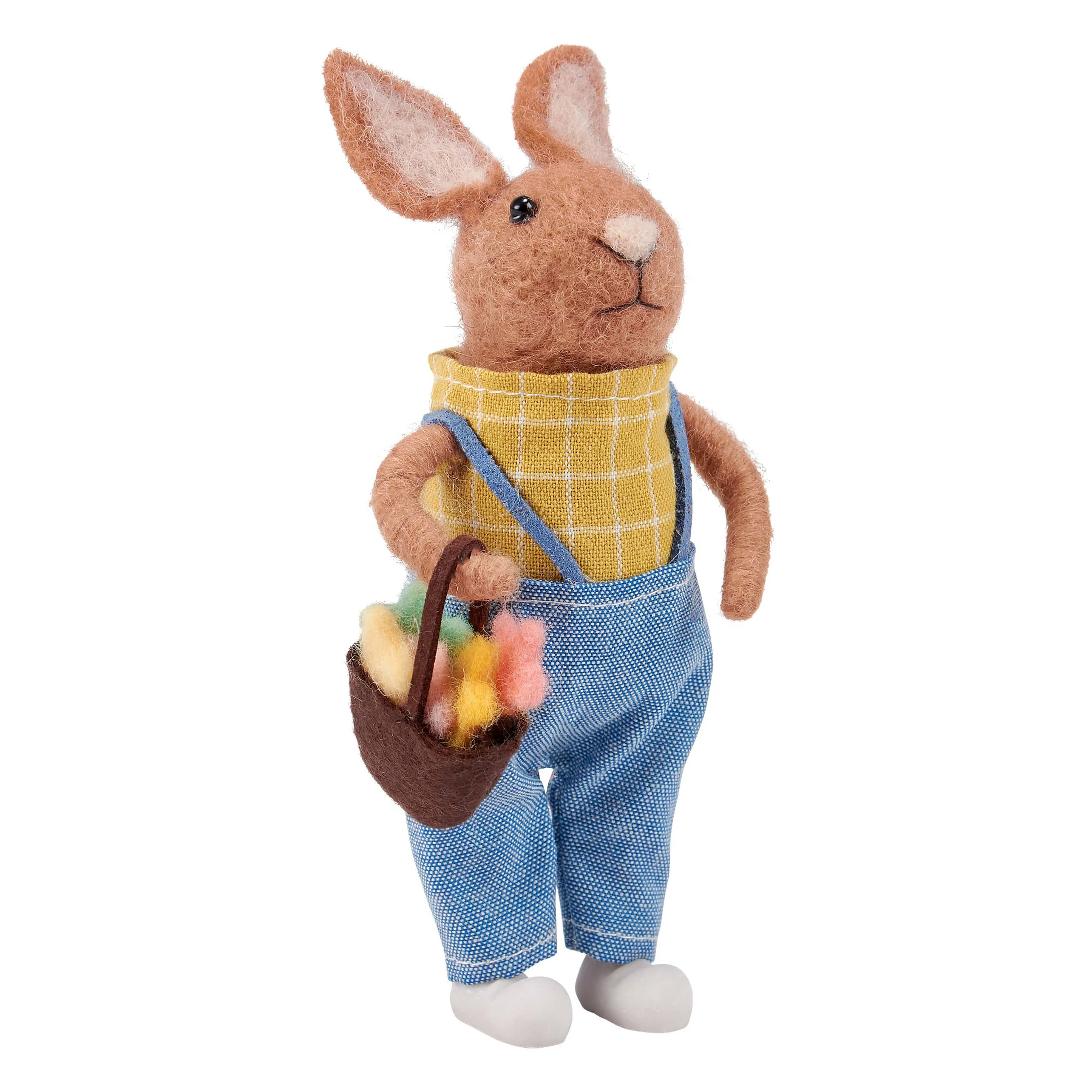 A brown felt vintage easter bunny figural decor wearing blue overalls and carrying a basket of colorful eggs