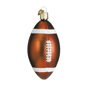 A glossy brown glass football ornament with white laces and stripes featuring a gold cap and tag figural decor