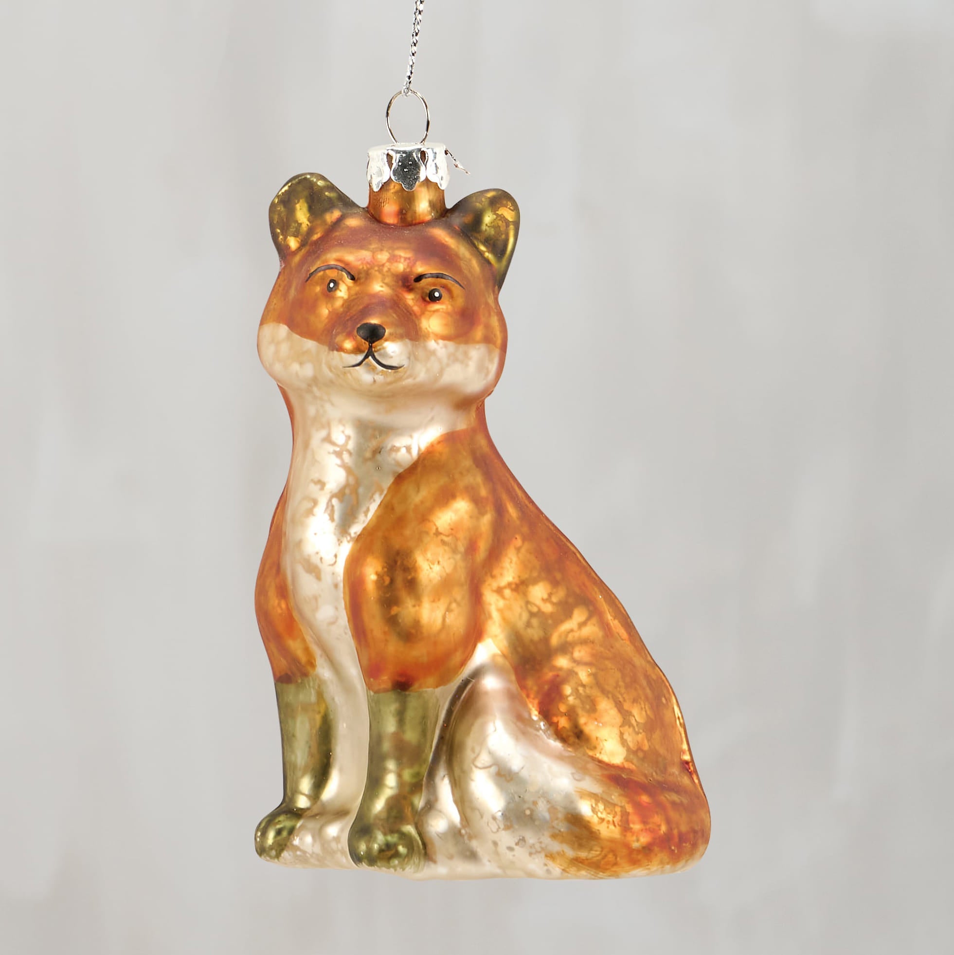 Glossy orange and silver fox glass ornament with gold tipped ears and a vintage inspired finish perfect for heart ornaments