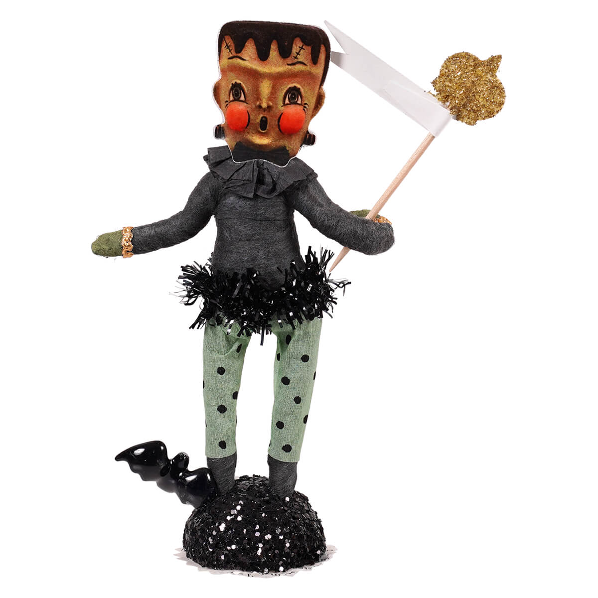 Frankie frankenstein figurine with gold face red cheeks black stitched hair in gray ruffled top and green polka-dot pants