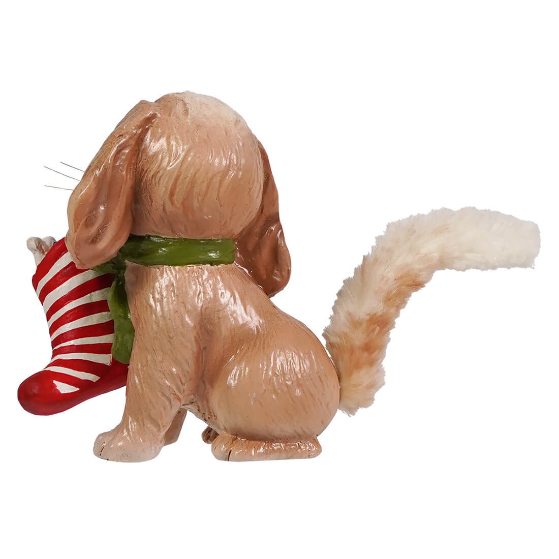 A tan glossy resin bethany lowe frankie puppy tablepiece with floppy ears holding a red white stocking for figural decor