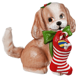 A bethany lowe design frankie puppy figurine in tan and white wearing a green bow tie holding a red and white stocking