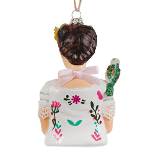 White glass frida kahlo ornament with glittery braided hair pink ribbon and colorful floral art ornament design