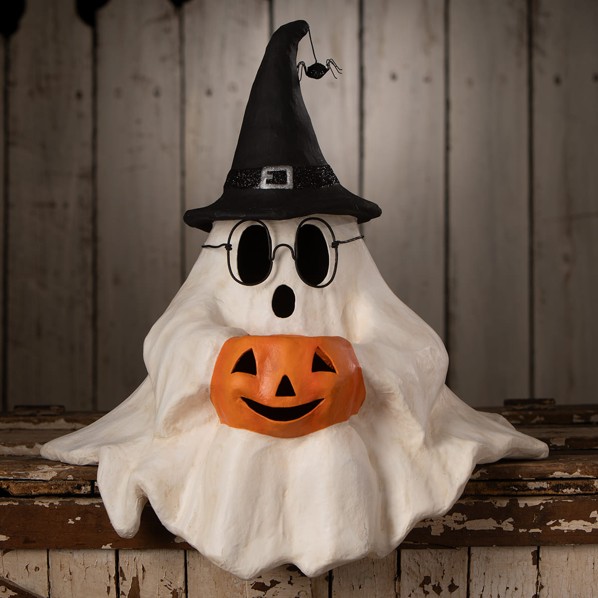 Frightened Fergus shelf sitter white halloween ghost figure decor with black witch hat glasses holding orange jack-o-lantern