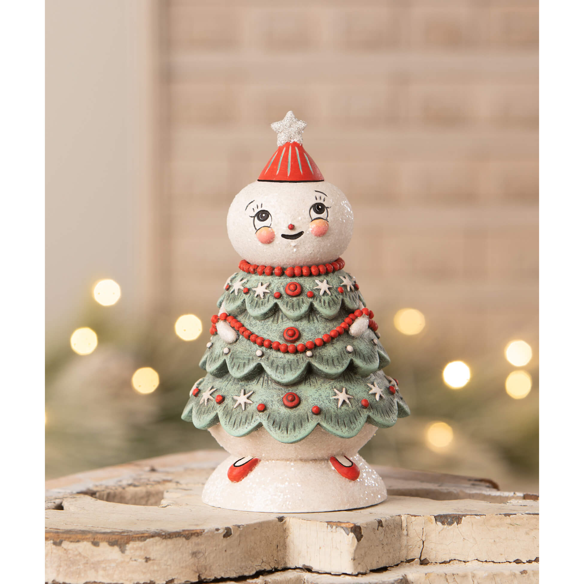 A charming white ceramic snowman figurine dressed as a green christmas tree with red beads from bethany lowe designs treena jolly jar