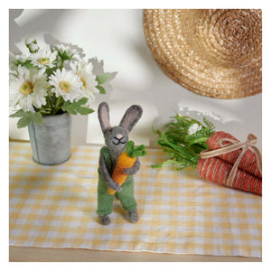 Gray felt garden rabbit critter wearing green knitted overalls holding orange carrot vintage easter bunny figural decor