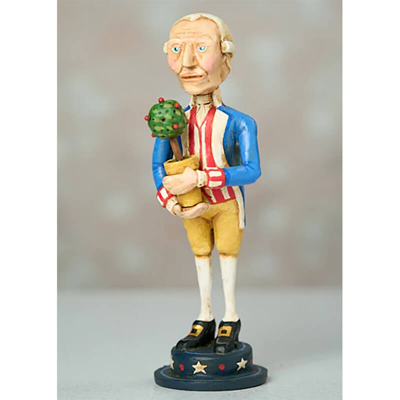 Folk art figurine of a colonial-style character holding a potted plant, wearing a blue jacket, yellow breeches, and standing on a star-decorated base.