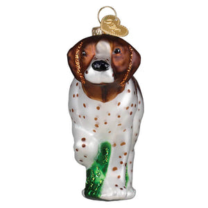 A glass christmas ornament featuring a brown and white german shorthaired pointer with green glitter paws and gold tag