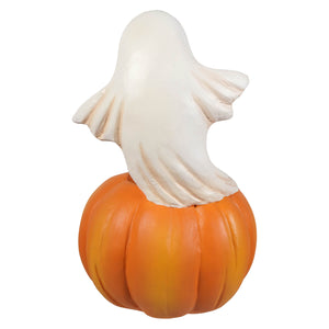 A white ghost figure perched on an orange plastic jack o lantern perfect for halloween ghost figures decor and ornaments